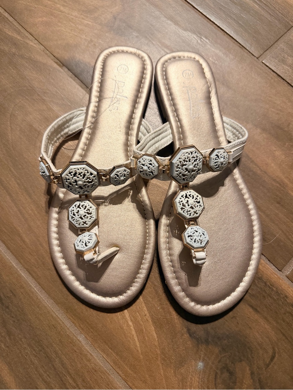 Women’s white and gold sandals